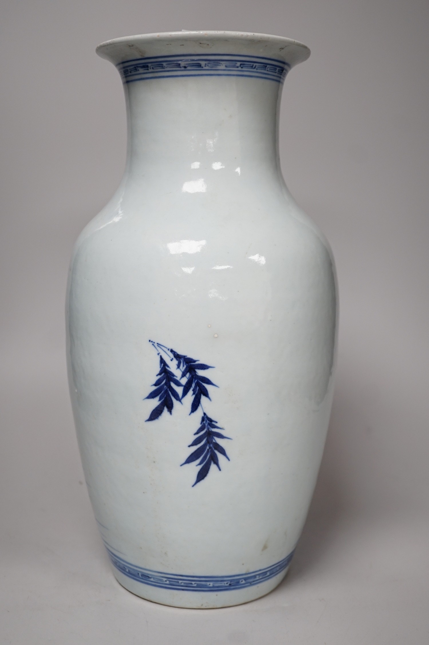 A large Chinese blue and white export vase, decorated with sages and attendants reviewing a scroll (a.f.), 37cms high